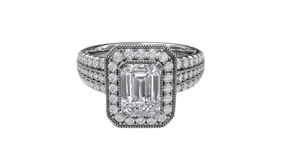 a silver toned halo engagement ring with an emerald cut center stone