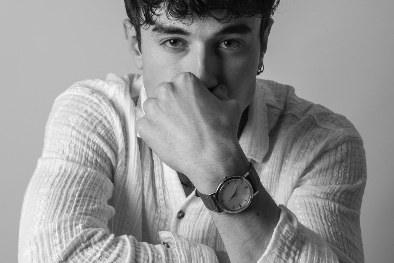 a man wearing nice clothes and a fine timepiece