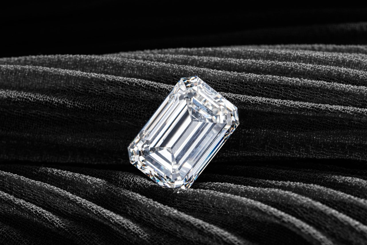 an emerald-cut diamond on a black background